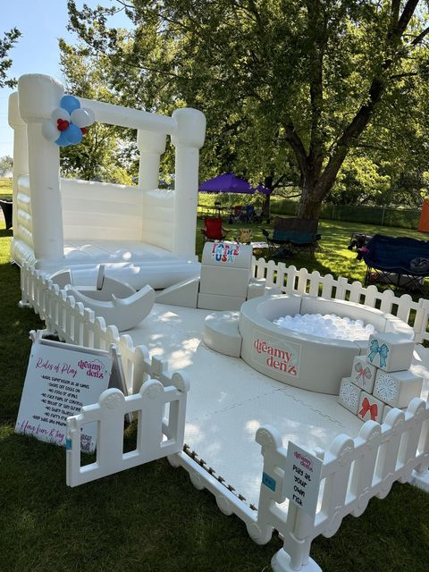 Fourth of July bounce house, soft play, and ball pit set up in the park